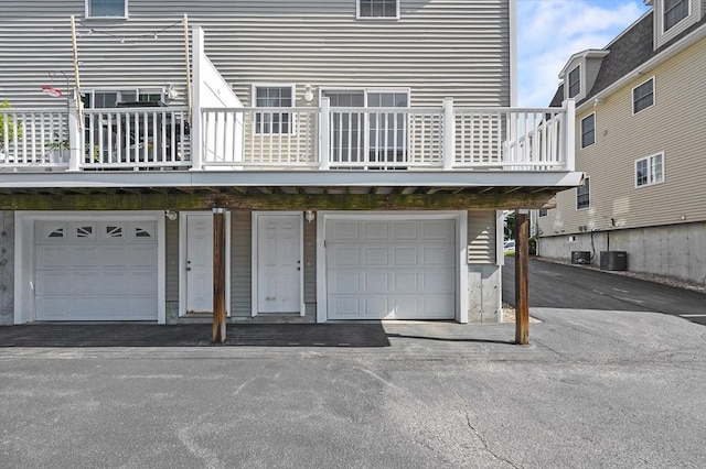8 School St Unit 1, Waltham, MA 02452 - back of house featuring central AC and a garage