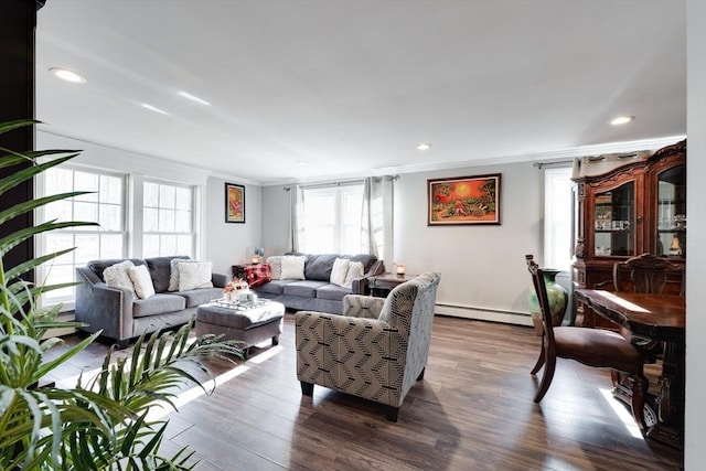 living area with recessed lighting, dark wood-style floors, baseboard heating, and ornamental molding