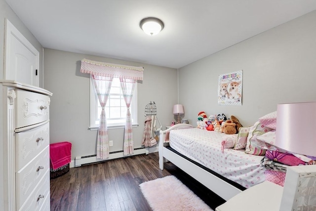 bedroom with baseboard heating and dark wood-style flooring