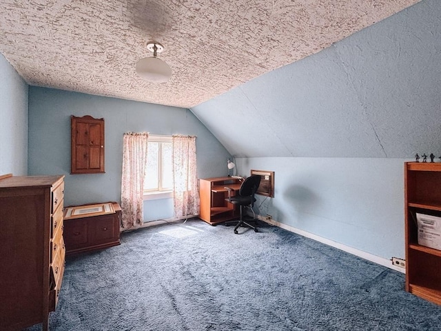 office with carpet, vaulted ceiling, a textured ceiling, and baseboards