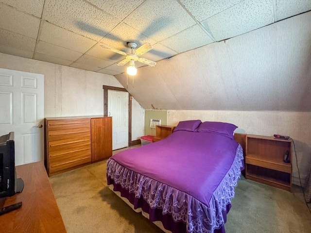 bedroom with carpet, ceiling fan, and vaulted ceiling