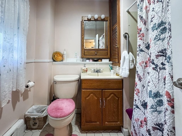 full bath with curtained shower, tile patterned floors, and vanity