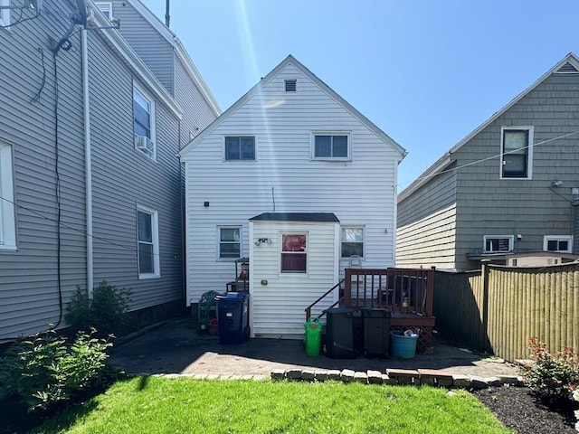 back of house with fence
