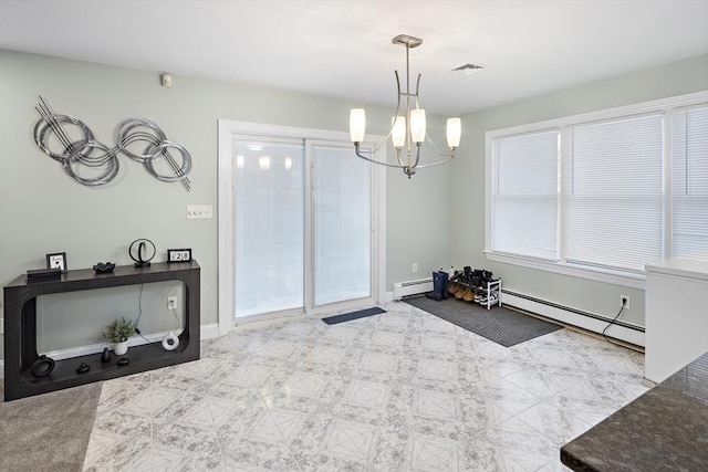 dining area with a chandelier and a baseboard radiator