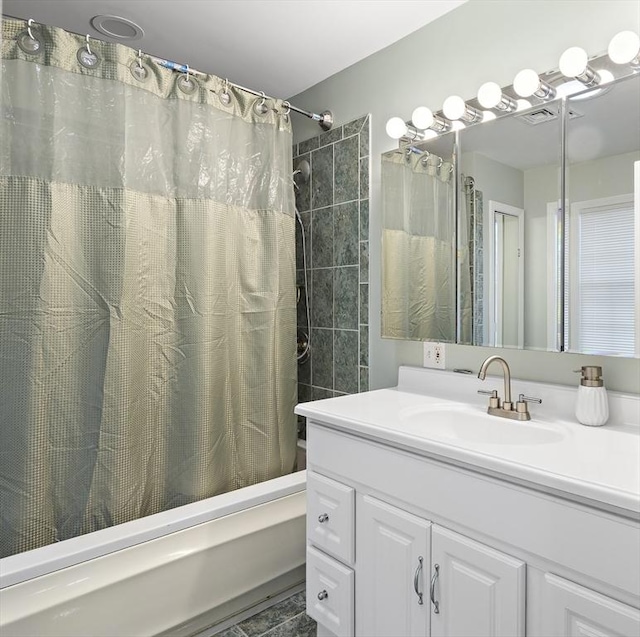 bathroom featuring vanity and shower / bath combination with curtain