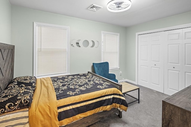 carpeted bedroom featuring a closet