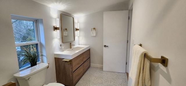 bathroom with toilet and vanity