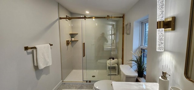 full bathroom with a shower stall and toilet