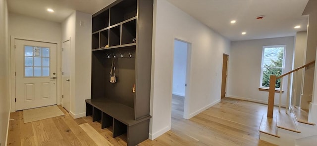 mudroom featuring baseboards, recessed lighting, and light wood-style floors