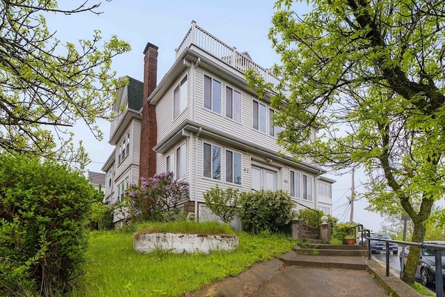 view of home's exterior featuring a chimney