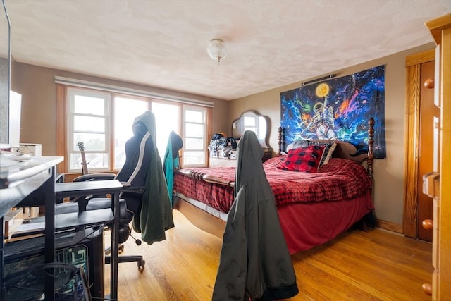 bedroom with wood finished floors