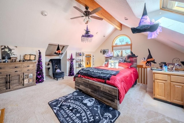 bedroom with light colored carpet and vaulted ceiling with beams