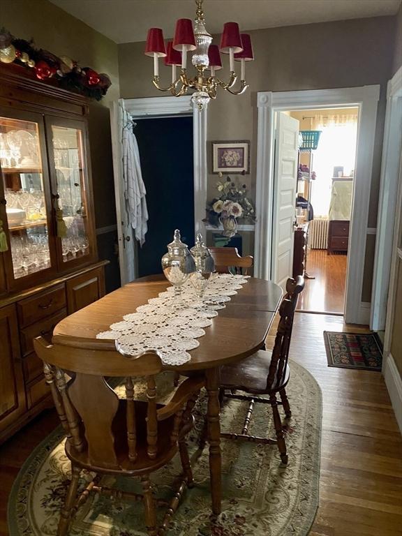 257 French St, Fall River, MA 02720 - dining room featuring a chandelier and dark wood-style floors