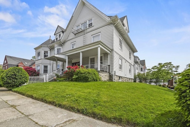 257 French St, Fall River, MA 02720 - view of front of house with a porch and a front yard