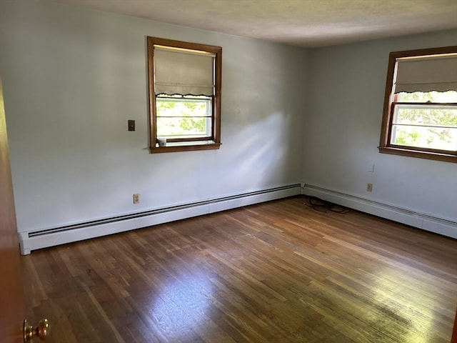 14 Rogers Cir, Braintree, MA 02184 - empty room featuring plenty of natural light, wood finished floors, and a baseboard radiator
