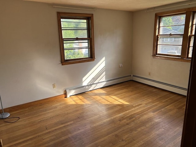 14 Rogers Cir, Braintree, MA 02184 - unfurnished room with hardwood / wood-style flooring, baseboards, and baseboard heating