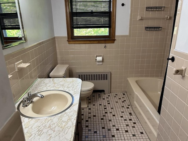 14 Rogers Cir, Braintree, MA 02184 - full bath featuring radiator heating unit, tile walls, toilet, a tub, and healthy amount of natural light