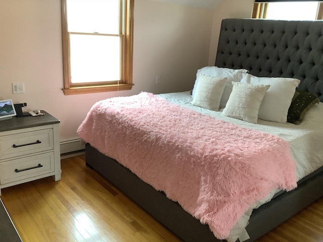11 Dyer, Everett, MA 02149 - bedroom featuring light wood-style flooring and baseboard heating