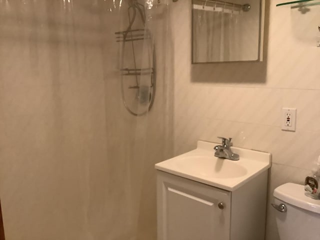 11 Dyer, Everett, MA 02149 - bathroom with tile walls, vanity, toilet, and a shower with curtain