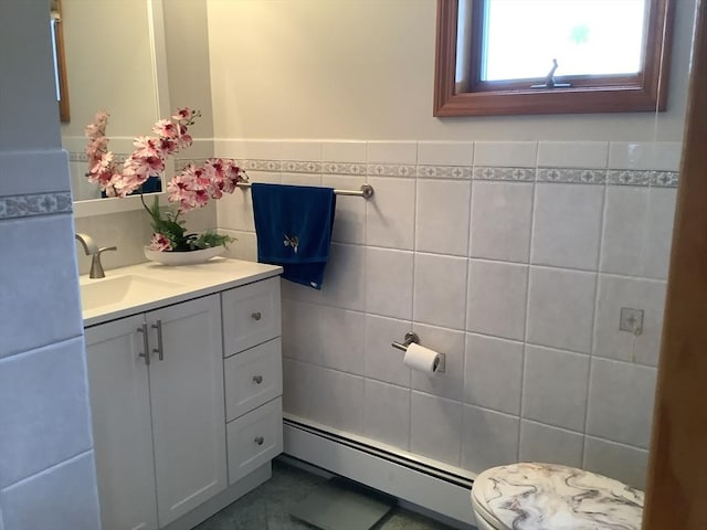 11 Dyer, Everett, MA 02149 - bathroom featuring a baseboard heating unit, vanity, and tile walls