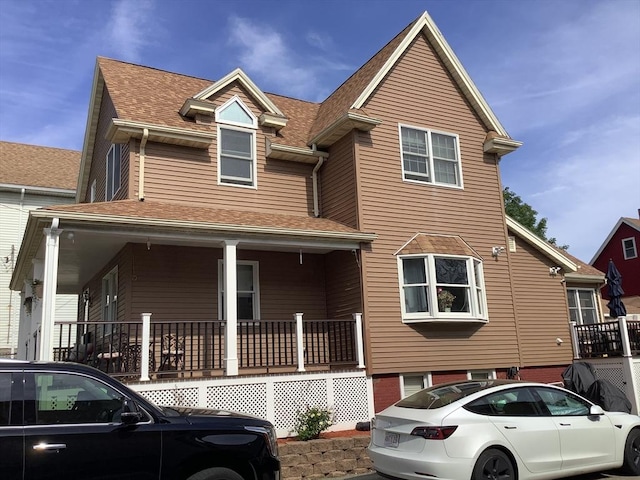 11 Dyer, Everett, MA 02149 - view of front of home with covered porch and a shingled roof