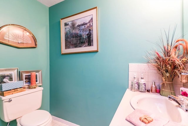 half bath with toilet and a sink