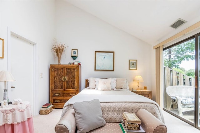 carpeted bedroom featuring access to exterior and high vaulted ceiling