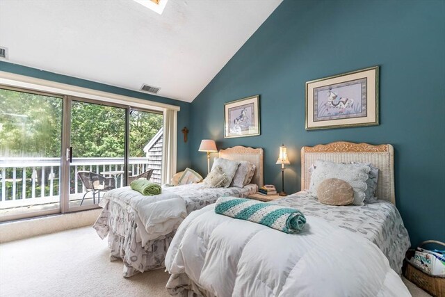 bedroom featuring access to exterior, lofted ceiling, and carpet