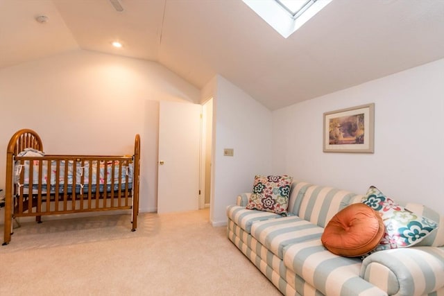 carpeted bedroom with lofted ceiling and a skylight