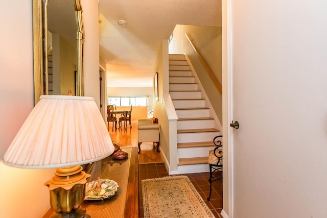 stairs with tile patterned floors