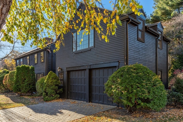 view of property exterior featuring a garage