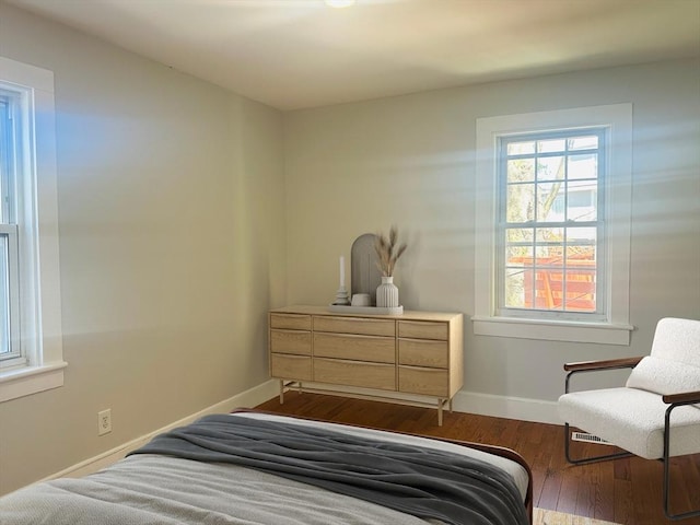24 Fifield St, Boston, MA 02122 - bedroom featuring dark wood-type flooring and baseboards