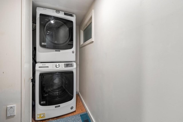 166 Water St Unit 166, Newburyport, MA 01950 - washroom with stacked washer / drying machine, wood finished floors, and baseboards