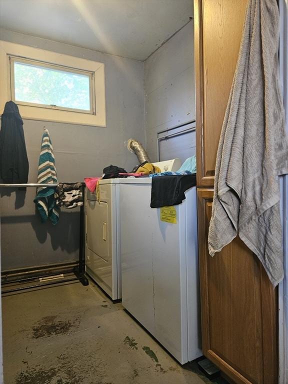 clothes washing area featuring separate washer and dryer