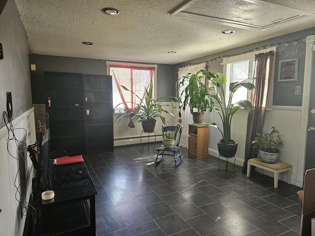 common area with a textured ceiling
