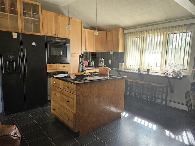 kitchen featuring black fridge, wall oven, dark countertops, dark tile patterned flooring, and tasteful backsplash
