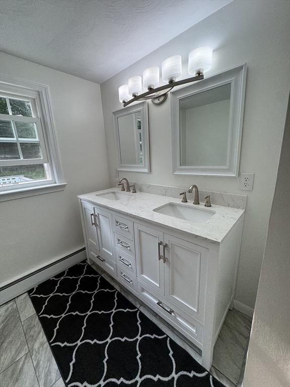 464 Church St, Raynham, MA 02767 - full bathroom featuring double vanity, a chandelier, and a baseboard radiator