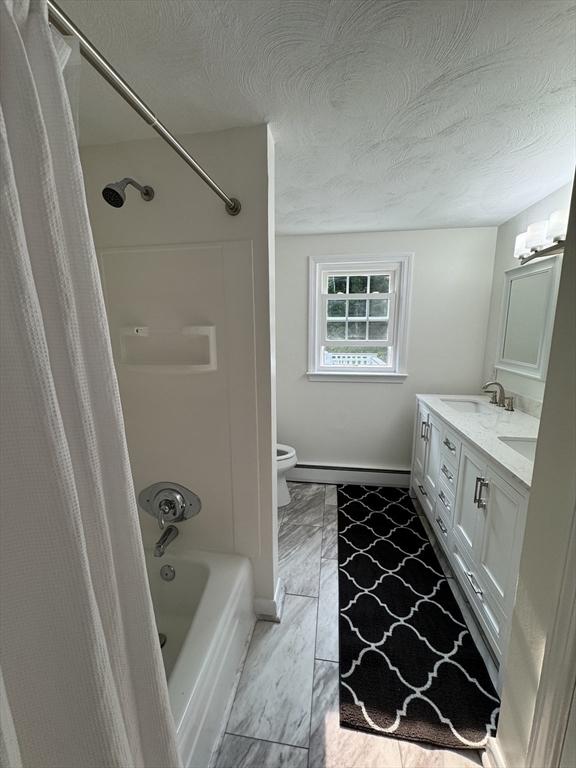 464 Church St, Raynham, MA 02767 - full bathroom featuring toilet, shower / tub combo with curtain, double vanity, a baseboard radiator, and baseboards