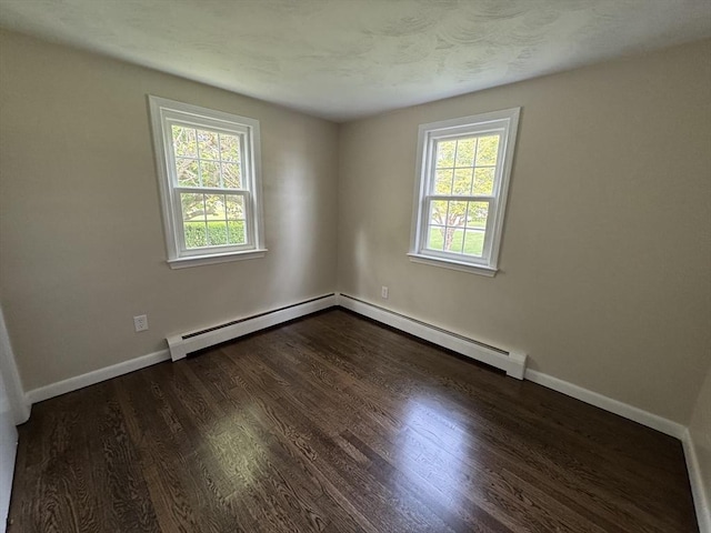 464 Church St, Raynham, MA 02767 - empty room featuring dark wood finished floors, baseboards, and a baseboard radiator