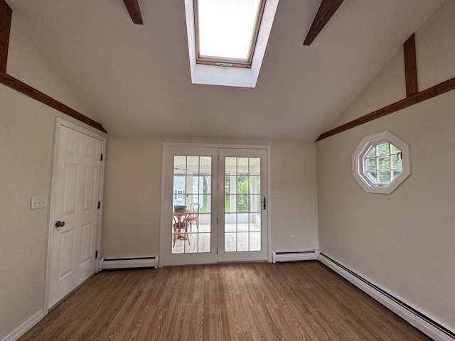 464 Church St, Raynham, MA 02767 - doorway to outside featuring baseboard heating, vaulted ceiling, wood finished floors, and a skylight