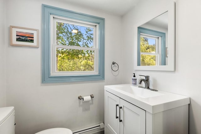 113 Bray St, Gloucester, MA 01930 - half bathroom featuring a baseboard heating unit, healthy amount of natural light, and vanity