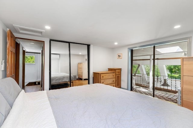 113 Bray St, Gloucester, MA 01930 - bedroom with access to outside, attic access, recessed lighting, two closets, and wood finished floors