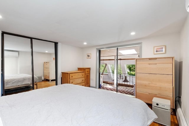 113 Bray St, Gloucester, MA 01930 - bedroom with access to exterior, a wall mounted AC, a baseboard radiator, recessed lighting, and wood finished floors