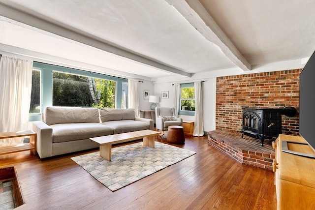 113 Bray St, Gloucester, MA 01930 - living room with beam ceiling, wood-type flooring, and a wood stove