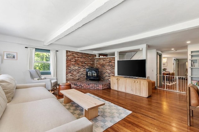 113 Bray St, Gloucester, MA 01930 - living room with a wood stove, wood finished floors, beamed ceiling, and recessed lighting