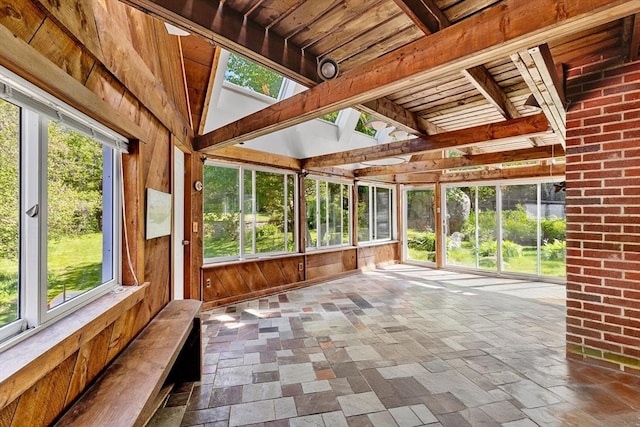 113 Bray St, Gloucester, MA 01930 - unfurnished sunroom featuring stone tile flooring, wooden walls, and wood ceiling