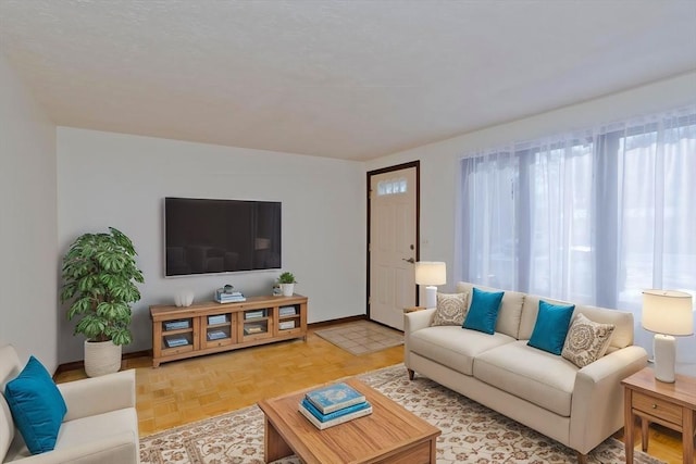 living room featuring parquet floors