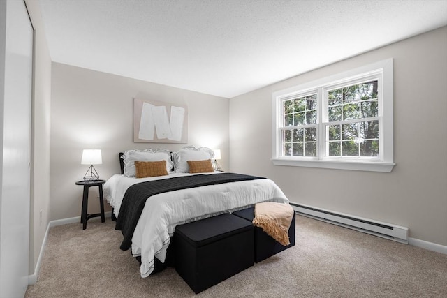 234 Low St Unit 16, Newburyport, MA 01950 - bedroom with a baseboard heating unit and carpet flooring