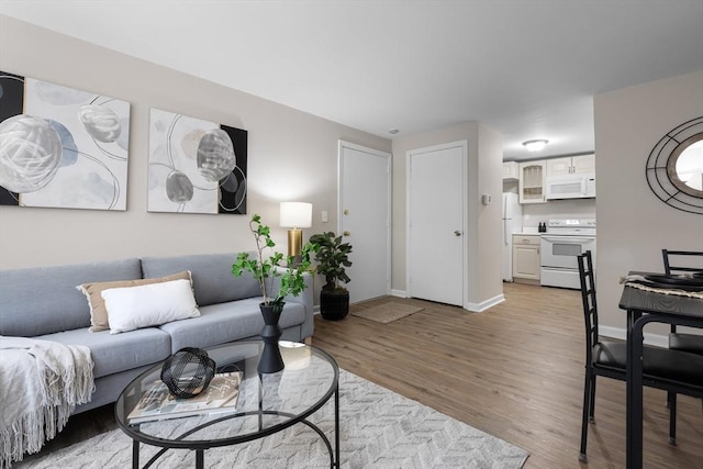 234 Low St Unit 16, Newburyport, MA 01950 - living area with wood finished floors and baseboards