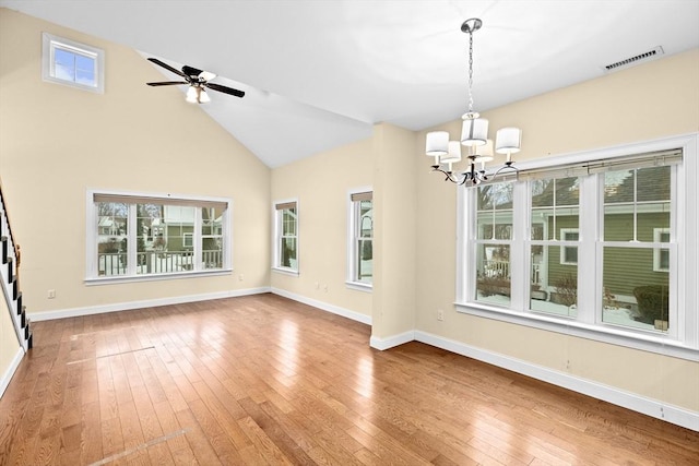 unfurnished dining area with hardwood / wood-style flooring, baseboards, visible vents, and a wealth of natural light